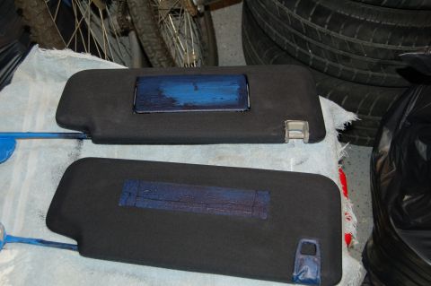 2007 Chevrolet Silverado 1500 - Two sun visors are shown with blue paint on a rectangular section of each.