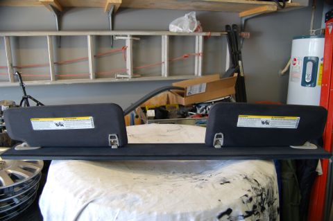2007 Chevrolet Silverado 1500 - Sun visors removed from a vehicle, displayed in a workshop setting.