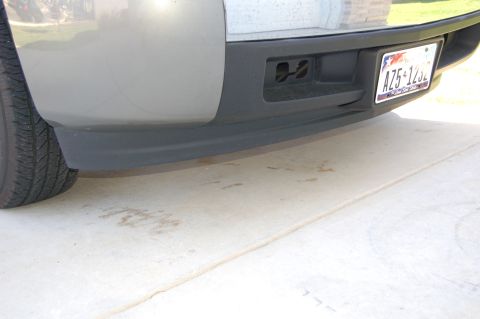 2007 Chevrolet Silverado 1500 - Close-up of a truck's rear bumper, showing the license plate and tow hitch receiver.