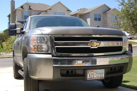 2007 Chevrolet Silverado 1500 - Front view of a gray 2007 Chevrolet Silverado 1500 pickup truck, its distinctive chrome grille and Texas license plate.