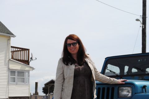 1991 Jeep YJ - A woman poses with a blue Jeep Wrangler in front of a house and a utility pole.