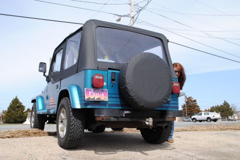 1991 Jeep YJ - This 1991 Jeep YJ is seen from the rear, its soft top and a spare tire mounted on the back.