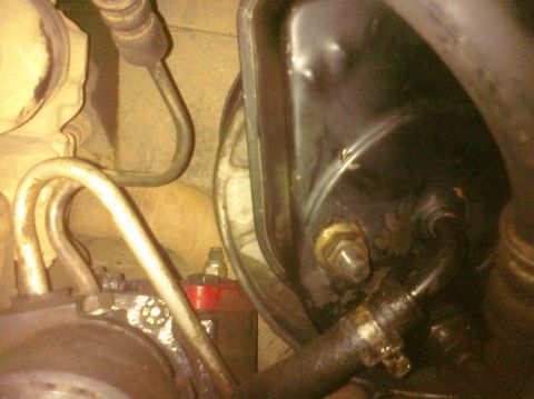 1995 Ford Bronco - Power steering pump and associated hoses, likely from an engine bay.