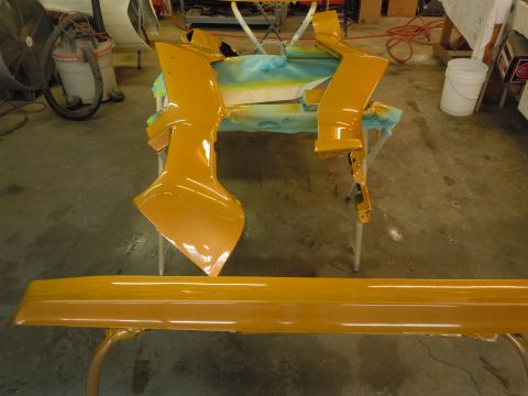 1970 Chevrolet Camaro - Car body parts are laid out on stands, likely for painting or repair.