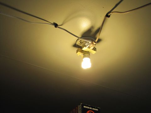 1993 Ford F-250 - A ceiling light fixture with a fluorescent bulb is wired to the ceiling.