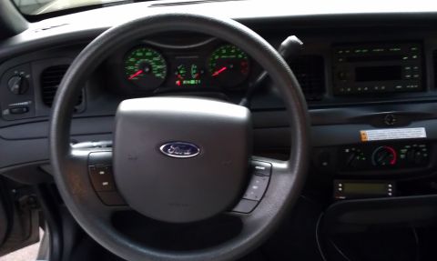 2007 Ford Crown Victoria - Interior view of a 2007 Ford Crown Victoria, showing the dashboard and steering wheel.