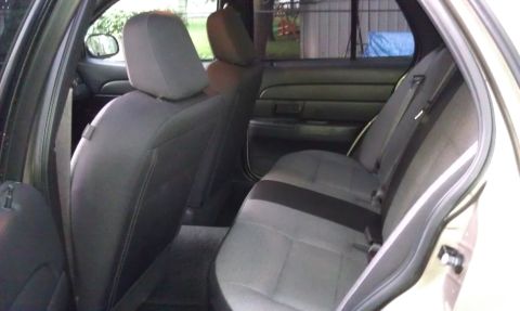 2007 Ford Crown Victoria - The interior of a 2007 Ford Crown Victoria shows the rear seating area.