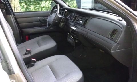 2007 Ford Crown Victoria - Interior view of a 2007 Ford Crown Victoria, highlighting the dashboard and seating.