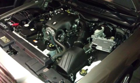 2007 Ford Crown Victoria - The engine bay of a vehicle, the V8 engine, air intake system, and battery components.