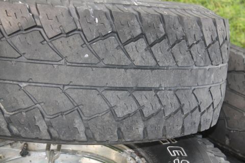 1996 Ford Bronco - A close-up view of a tire's tread pattern, with a website address visible in the lower right corner.