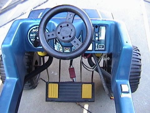 1985 Ford F-150 - Interior view of a blue toy truck, showing the steering wheel and dashboard controls.
