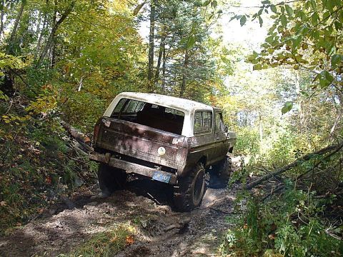 1978 Ford Bronco - This 1978 Ford Bronco navigates a challenging muddy trail through the woods.