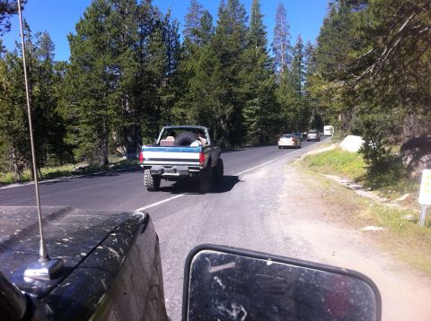 1990 Ford Bronco - Following a lifted 1990 Ford Bronco on a scenic drive through a forest.
