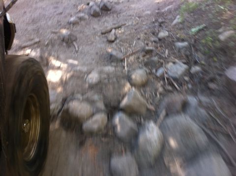 1990 Ford Bronco - Driving over a rocky trail.
