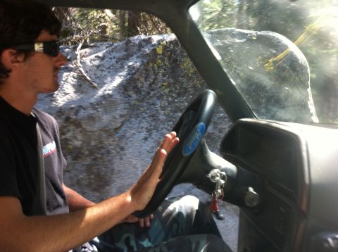 1990 Ford Bronco - Driver navigates a rocky off-road trail from inside the vehicle.