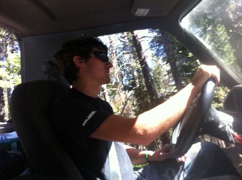 1990 Ford Bronco - Driver's perspective inside a vehicle on a wooded trail.