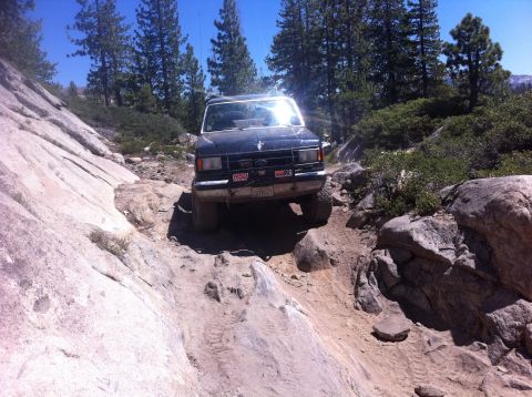 1990 Ford Bronco - This 1990 Ford Bronco is tackling a challenging off-road path.