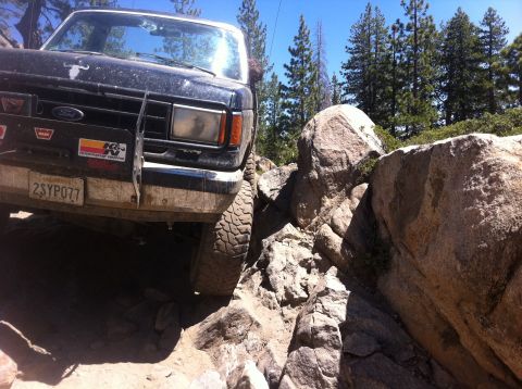 1990 Ford Bronco - This 1990 Ford Bronco tackles a challenging off-road course with large boulders.