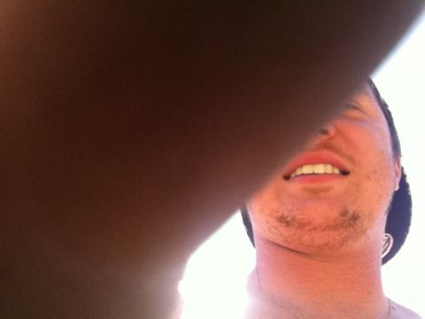 1990 Ford Bronco - A man's face is partially obscured by a shadow, with a website logo visible at the bottom.