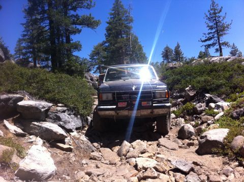 1990 Ford Bronco - This 1990 Ford Bronco is shown off-roading on a sunny day.