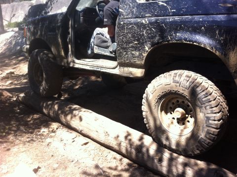 1990 Ford Bronco - This 1990 Ford Bronco navigates a challenging off-road obstacle on a rocky trail.