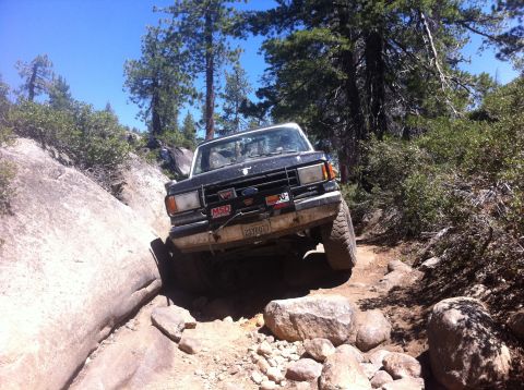 1990 Ford Bronco - This 1990 Ford Bronco tackles a challenging rocky path, its off-road capabilities.