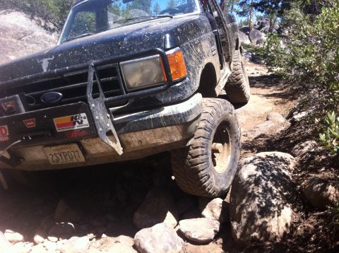 1990 Ford Bronco - This Ford truck is navigating a difficult, rocky off-road trail.