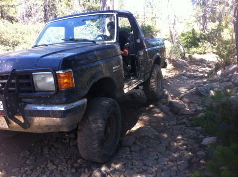 1990 Ford Bronco - This 1990 Ford Bronco is shown off-road on a rocky path.