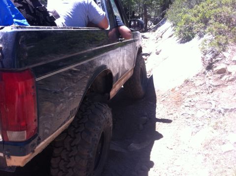 1990 Ford Bronco - This 1990 Ford Bronco navigates a challenging rocky trail, its off-road capabilities.