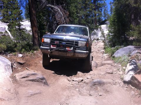 1990 Ford Bronco - This 1990 Ford Bronco navigates a challenging rocky off-road path.