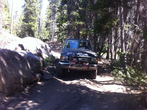 1990 Ford Bronco - This 1990 Ford Bronco navigates a rocky, wooded trail.
