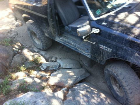 1990 Ford Bronco - This 1990 Ford Bronco is shown navigating a challenging rocky off-road course.