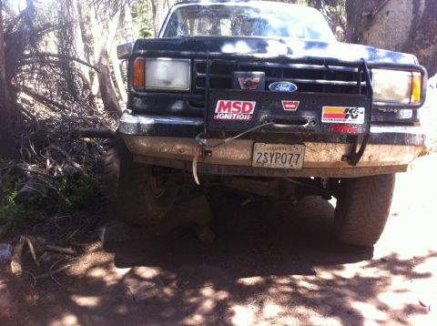 1990 Ford Bronco - This black Ford truck, equipped for off-roading, displays a California license plate.