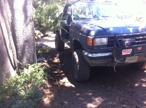 1990 Ford Bronco - 1990 Ford Bronco navigating a wooded trail during Slick Rock '11.