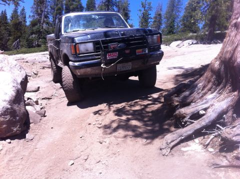 1990 Ford Bronco - This Ford pickup is navigating a rocky, off-road trail.
