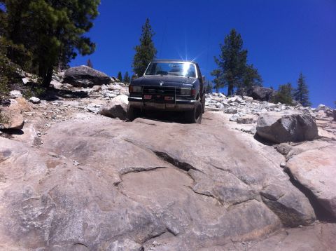 1990 Ford Bronco - This 1990 Ford Bronco is shown off-roading on a challenging rocky path.