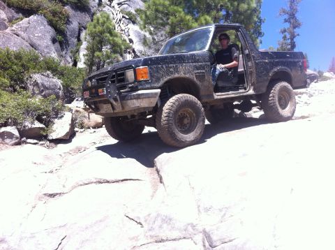 1990 Ford Bronco - This 1990 Ford Bronco tackles a challenging rocky trail, its off-road capabilities.