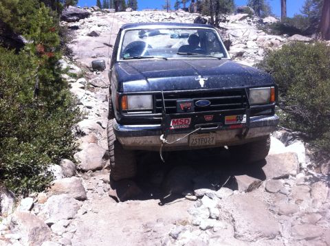 1990 Ford Bronco - This Ford Bronco navigates a challenging rocky trail, its off-road capabilities.