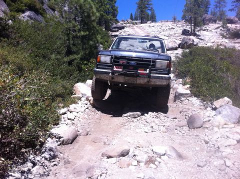 1990 Ford Bronco - This 1990 Ford Bronco navigates a challenging rocky terrain on an off-road trail.