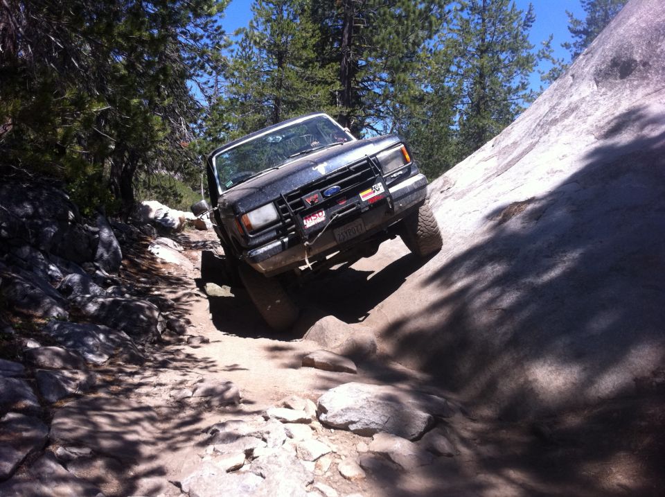 1990 Ford Bronco on rocky trail, 3q-front view