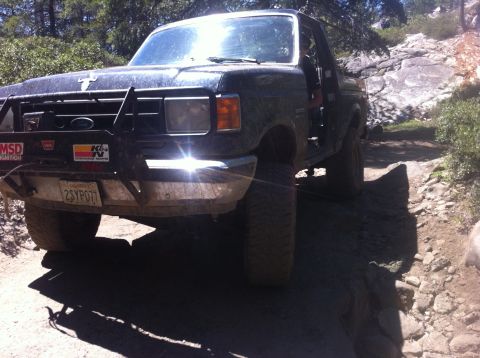 1990 Ford Bronco - This 1990 Ford Bronco navigates a challenging off-road path, its capabilities.