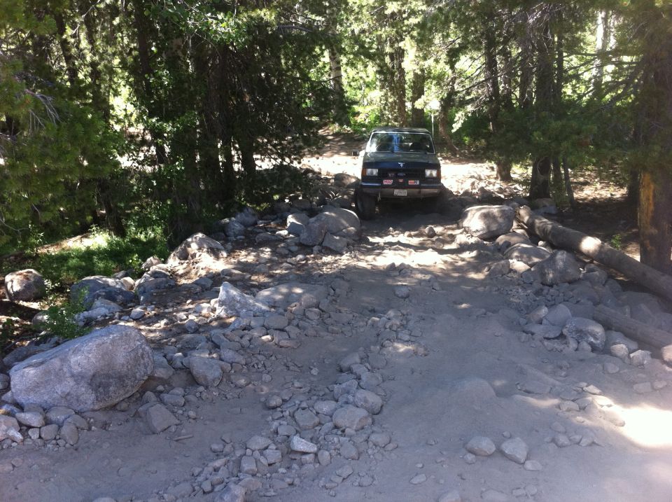 1990 Ford Bronco on a rocky trail