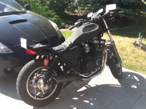 2002 Kawasaki Ninja - Motorcycle parked outdoors, showing its engine and rear wheel detail.