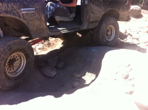 1990 Ford Bronco - This 1990 Ford Bronco is shown off-roading over large rocks.