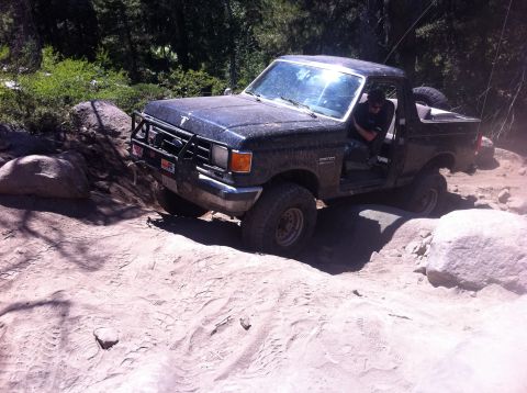 1990 Ford Bronco - This 1990 Ford Bronco is tackling a challenging rocky trail during an off-road excursion.