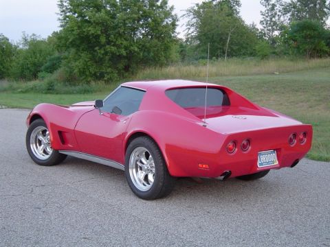 1976 Chevrolet Corvette - The rear view of a red 1976 Chevrolet Corvette shows its distinctive taillights and quad exhaust pipes.