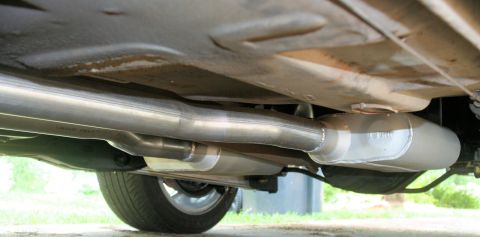 1976 Ford Ranchero - Underside view of a vehicle's exhaust system, including a muffler and pipes.
