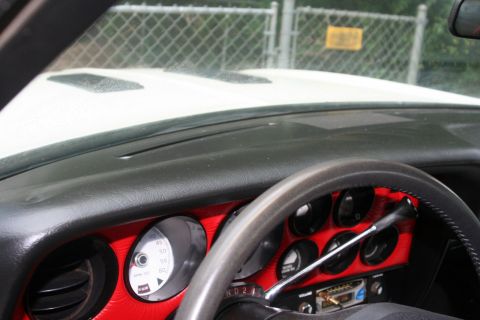 1976 Ford Ranchero - Close-up of a car's dashboard, a steering wheel and various gauges.