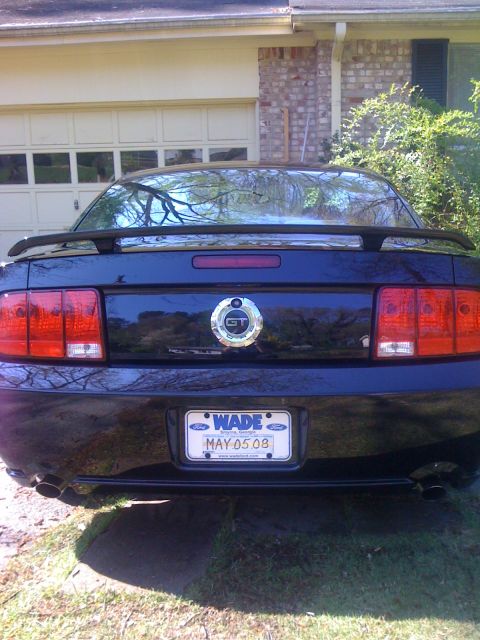 2008 Ford Mustang - Rear view of a 2008 Ford Mustang GT, showing the GT badge and a custom license plate.