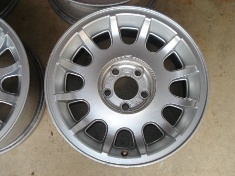 2000 Ford Crown Victoria - A single silver turbine wheel, likely from a Ford vehicle, is shown up close.